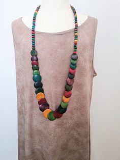 "Multi Colored Long Boho Wood Vintage Necklace. Vintage Wood Bohemian Necklace Long Necklace. Rainbow Wood Vintage Long Wood Necklace Such a pretty piece comprised of Vintage Rainbow Wood and Disc Multi Colored Rainbow Wood Beads. Beautiful Necklace! Necklace is 35 inches long Don't miss out! *If you have have any questions regarding this item, please hit the \"Ask a Question\" button next to the price and I will get back to you within 24 hours:-) We pride ourselves on 100% customer service, ple Bohemian Jewelry With Wooden Beads, Wooden Beads Round Necklace For Beach, Bohemian Long Necklace With Wooden Beads, Unique Multicolor Necklaces For The Beach, Multicolor Wooden Beads Long Necklace Gift, Multicolor Wooden Beads Jewelry, Multicolor Wooden Round Beads Jewelry, Multicolor Wooden Beaded Jewelry, Multicolor Wooden Round Bead Jewelry