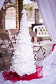 a white christmas tree sitting on top of a table