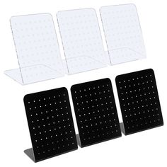 three pieces of black plastic with dots on them