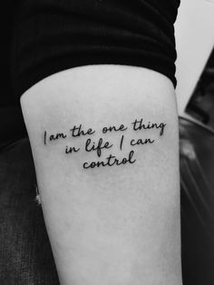 a person with a tattoo on their arm that says i am the one thing in life i can control