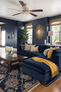 a living room filled with furniture and a ceiling fan