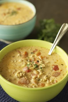 two bowls filled with soup on top of a table