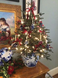 a decorated christmas tree with red, white and blue ornaments