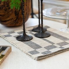 two wine glasses sitting on top of a place mat