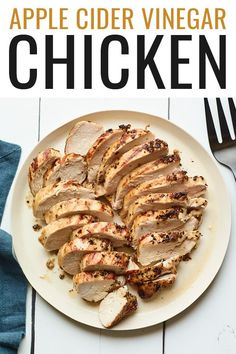 sliced chicken on a plate with fork and knife next to it, ready to be eaten