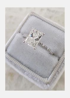 an engagement ring with a princess cut diamond