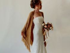 The hand-knit triangular camel shawl is a beautiful accessory that will add elegance to your winter wedding or evening occasions. Moreover, the beige cover up is versatile enough to match any outfit and provides warmth and protection during the fall, winter, and spring seasons. Moreover, these wraps make an excellent bridesmaid gift. MATERİAL:  Very soft, fuzzy and warm yarn. it is not itchy at all. 10% mohair, 10% wool, 80% premium acrylic-Polyamid,  MEASUREMENTS (Average): Length: 78'' (200cm) Bohemian Wedding Shawl For Winter, Bohemian Winter Wedding Shawl, Elegant Fringed Shawl For Wedding, Elegant Fringe Shawl For Wedding, Bohemian Beige Shawl For Wedding, Beige Bohemian Shawl For Wedding, Bridal Cover Up, Winter Wrap, Pale Aqua