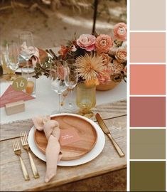 an image of a table setting with flowers and wine glasses in the center, along with utensils