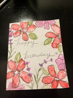 a happy birthday card with flowers on it