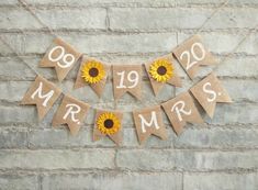 sunflowers are placed on burlock with the words mr and mrs