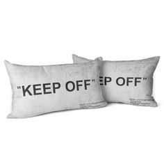 two pillows with the words keep off on them