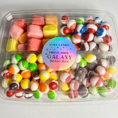 a plastic container filled with assorted candy