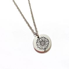 "This beautiful necklace is hand stamped with a delicate daisy on a pewter 5/8\" circle. The piece is finished with an 18\" stainless steel chain. The daisy is the birth month flower for April. All pieces are made to order so there is no upcharge for most personalization. All items are stamped by hand! Some slight variances in the pattern may occur as a result adding to the uniqueness of the piece. Are you looking for something custom? Let me know! I'd be happy to try and accommodate your reques Month Flowers, Birth Month Flowers, Birth Month, Flower Necklace, Stainless Steel Chain, Hand Stamped, Washer Necklace, Beautiful Necklaces, Charm Necklace