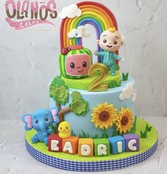 a birthday cake decorated with animals and letters