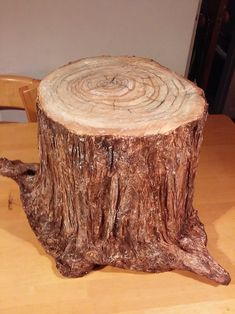 a tree stump sitting on top of a wooden table