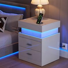 a night stand with a cell phone on it