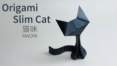 an origami cat made out of black paper with the words, orgasmi slim cat