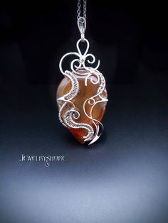 This crystal pendant wrapped in silver wire with a natural Moss Agate.                                                                                                                                                                                               It can be a unique decoration for a festive occasion or lovely gift. Gothic Filigree, Gemini Birthstone, Red Moss Agate, Moss Agate Jewelry, Moss Agate Crystal, Elven Jewelry, Wire Wrap Pendant, Unique Decoration, Filigree Pendant