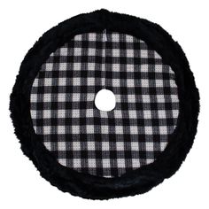 a black and white checkered cloth with a circular hole in the center