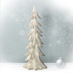 a white christmas tree sitting on top of a table