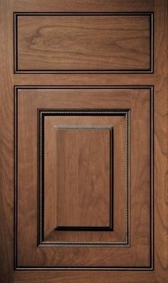 a close up view of a wooden cabinet door