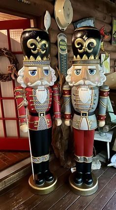 two wooden nutcrackers standing next to each other