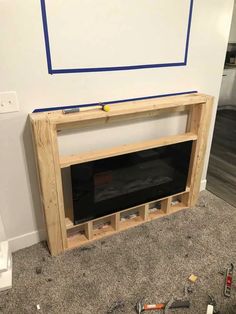 an unfinished fireplace is being built in the living room