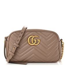 This is an authentic GUCCI Calfskin Matelasse Small GG Marmont Chain Shoulder Bag in Porcelain Rose. This shoulder bag is crafted of smooth and supple beige pink calfskin leather. This crossbody bag features an aged gold chain with a leather shoulder strap and a gold GG logo. The top zipper opens to a beige microfiber interior with a patch pocket. Gg Marmont Small Matelassé Shoulder Bag, Gg Marmont Small Shoulder Bag, Gg Marmont Bag, Eco Bags, Gucci Crossbody, Gucci Gg Marmont, Outfit Trends, Gg Marmont, Gucci Handbags