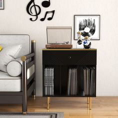 a living room with a couch, table and musical notes on the wall above it