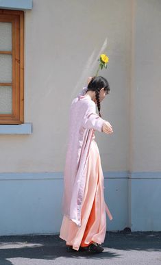 Step into a harmonious blend of history and modern fashion with the colorful Jüzi Qishui 橘子汽水 Orange Soda Changshan & Double Layered Trousers Set! The Changshan 长衫 (long shirt) is made from lightweight and breathable floral jacquard, featuring a contrast trim down the length of the jacket. Elongates the body and adds an extra layer of coverage! Side slits allow the rest of the outfit to peek through and adds ventilation, perfect for even the warmest of days. The Song Ku 宋裤 (Song Dynasty trousers Pink Kimono For Spring Wedding, Traditional Ceremonial Sets For Spring, Spring Wedding Pink Kimono, Traditional Spring Kimono, Traditional Pink Kimono For Spring, Traditional Spring Wedding Kimono, Traditional Long Kimono For Spring, Long Pink Festive Kimono, Ceremonial Pink Long Sleeve Sets