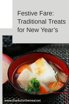 a red bowl filled with soup and vegetables