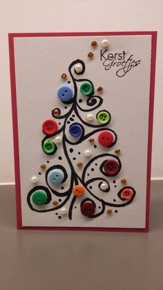 a christmas tree made out of buttons on a white card with the words kerste greifs