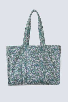 HANDMADE EDITION a panel blockprinted bag in a sturdy canvas, to tote everything from your laptop to your gym clothes. the snaps on the sides can be undone for more space. two interior pockets. dimensions: 19" W x 13" H x 6" D handle drop: 10.5" made of 100% cotton canvas. lined in 100% cotton. made in india. spot clean. Weekend Cotton Bags With Pockets, Weekend Cotton Bag With Pockets, Weekend Cotton Bag With Double Handles, Cotton Weekend Bag With Pockets, Green Cotton Canvas Bag With Double Handle, Blue Cotton Canvas Bag With Double Handle, Green Cotton Double Handle Canvas Bag, Green Reversible Cotton Shoulder Bag, Trendy Cotton Shoulder Bag For Weekend