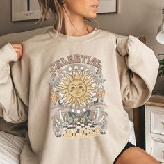 This vintage inspired Celestial Sun and Mushroom sweatshirt is the perfect gift for the mystical person in your life! Find more styles here: www.etsy.com/shop/jadeandroseshop ❤️ Please note that for the oversized look you need to buy 1-3 sizes larger than you normally wear. If you prefer the standard Unisex fit order your typical size. For women, if you prefer a more women's fit sweatshirt please size down 1 size, as this sweatshirt is a Unisex fit ❤️ This unisex heavy blend crewneck sweatshirt Vintage Relaxed Fit T-shirt, Bohemian Crew Neck Relaxed Fit Sweatshirt, Bohemian Crew Neck Sweatshirt With Relaxed Fit, Bohemian Relaxed Fit Crew Neck Sweatshirt, Mushroom Sweatshirt, Celestial Shirt, Boho Sweatshirt, Celestial Sun, Sun Shirt