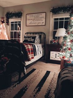 a bedroom decorated for christmas with a tree