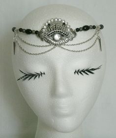 "Chakra Eye Circlet This beautiful circlet has black glass beads, silver plated filigree beads, silver plated filigree accents, silver plated chain, rhinestones and a sterling silver plated pendant with clear glass eye setting. 20\" long can be adjusted to 24\" long. Sterling silver plated lobster clasp." Adjustable Gothic Masquerade Headpieces, Adjustable Gothic Headpieces For Masquerade, Silver Gothic Metal Body Jewelry, Gothic Silver Metal Body Jewelry, Silver Gothic Body Jewelry, Handmade Gothic Body Jewelry For Party, Silver Beaded Metal Body Jewelry, Handmade Silver Body Jewelry For Festivals, Handmade Black Metal Body Jewelry