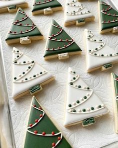 christmas cookies decorated with green and white icing