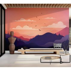 a living room with a large mural on the wall