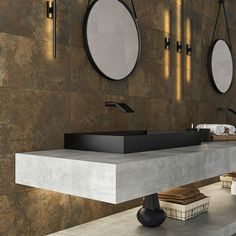 a modern bathroom with two sinks and mirrors on the wall above it, along with other accessories