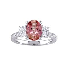 Designed with an oval-cut pink tourmaline center stone set between a pair of dazzling, lab-created white sapphire accents, this Stella Grace ring is a beautiful way to profess your love.Click on this JEWELRY & WATCHES GUIDE to learn about fit, styles, materials and more! Nickel free Metal: 14k white gold Packaging: boxed Plating: rhodium Width: 8.9 mm Finish: polishedSTONE DETAILS Stone type: pink tourmaline Total weight: 1 9/10 ct. Center stone weight: 9 mm x 7 mm Shape: oval Setting: prongDIAM Oval Tourmaline White Gold Rings, Pink Oval Three Stone Jewelry, Pink Oval Three-stone Jewelry, Classic Pink Oval Topaz Ring, Pink Oval Topaz Ring With Center Stone, Pink Oval Topaz Fine Jewelry Ring, Oval Tourmaline Ring With Center Stone, Gold Packaging, Oval Setting