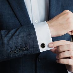 Classic and chic, our Silver and Onyx Cufflinks grant an immediate ensemble boost to your formal wardrobe. Smooth, deep Onyx discs nestle inside silver-finished settings for a simple, classic look suitable for any event. The expert craftsmanship of our base metal cufflinks ensures long-lasting durability. Pairs perfectly with our Onyx Inlaid Tie Clip. Modern Black Cufflinks For Business, Elegant Silver Cufflinks For Office, Silver Timeless Cufflinks For Formal Wear, Timeless Silver Cufflinks For Formal Events, Timeless Silver Cufflinks For Formal Occasions, Timeless Silver Cufflinks For Formal Wear, Modern Round Cufflinks For Formal Occasions, Black Cuff Jewelry For Business, Classic Cuff Jewelry For Professional Use