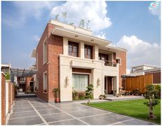 a large brick house with lots of windows