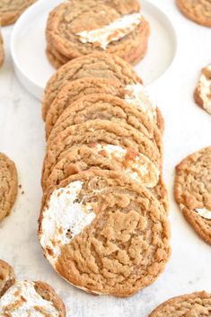 several cookies with white frosting on them