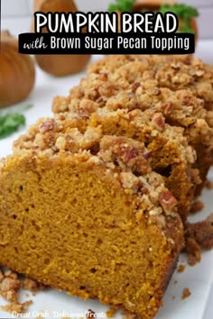 pumpkin bread with brown sugar pecan topping on a white platter next to other food items