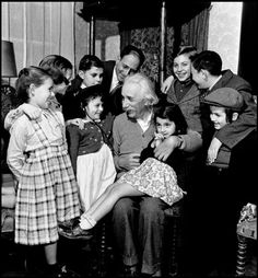 an old black and white photo of people gathered together