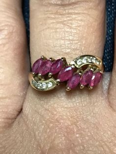 STUNNING 14K YELLOW GOLD DIAMOND RUBY RING This gorgeous 14k gold ruby and diamond ring will make a perfect addition to any jewelry collection! In excellent pre-owned condition! 7 - marquis cut rubies each .10CT. 10 - .1CT small round diamonds 5 on each side. 2.7 Grams of 14K gold! Shipped insured/delivery confirmation I guarantee item to be exactly as described and pictured. Marquise Ruby Ring In Gold, Gold Marquise Cut Ruby Diamond Ring, Gold Ruby Ring With Marquise Cut And Accent Stones, Gold Ruby Ring With Marquise Cut, Gold Marquise Cut Ruby Ring, Gold Ruby Marquise Cut Jewelry, Marquise Cut Ruby Jewelry In Yellow Gold, Gold Marquise-cut Ruby Jewelry, Gold Marquise Cut Ruby Jewelry