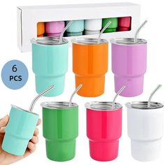 six color tumbler cups with straws in each cup and one hand holding the lid