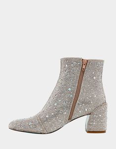 Add some flair to your outfits with the GAIL ankle booties that take everything up a notch! These sparkly booties showcase a reliable and cozy block heel and are fully decked out with silver metallic rhinestones. Prepare to shine! Rhinestone embellished ankle boots Side zipper closure Textile lining Betsey Blue sole 2.25 inch heel height 4.75 inch shaft height 10.5 inch shaft circumference Imported Satchel Backpack, Dress Flats, Crossbody Clutch, Blue Jewelry, Spring Trends, Flat Boots, Sneaker Heels, Slipper Boots, To Shine