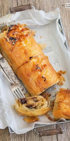 a piece of bread on a tray with a fork