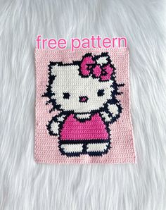 a hello kitty crochet pattern on a white blanket